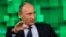 FILE - Russian President Vladimir Putin speaks during his visit to the new headquarters of "Russia Today" TV channel in Moscow, June 11, 2013. 