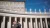 A faithful wait under the closed window of the Apostolic Palace at The Vatican, Feb. 16, 2025, from where Pope Francis, who was hospitalized on Friday, blesses the faithful gathered in St. Peter's Square every Sunday. 