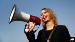 FILE - Chelsea Manning addresses participants at an anti-fracking rally in Baltimore, Maryland, April 18, 2018.