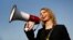 FILE - Chelsea Manning addresses participants at an anti-fracking rally in Baltimore, Maryland, April 18, 2018.