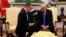 President Donald Trump prays with American Pastor Andrew Brunson in the Oval Office of the White House, Oct. 13, 2018, in Washington. Brunson returned to the U.S. after he was freed Friday, having been detained for nearly two years in Turkey.