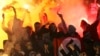 RUSSIA – People demonstrate as they hold a Nazi flag displaying a swastika at the stands of the Spartak Moscow supporters during the Russian Cup 1/16 soccer match finals. 