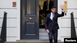 New leader of the Britain's Conservative Party Rishi Sunak walks outside the Conservative Campaign Headquarters, in London, Oct. 24, 2022. 