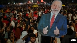 Supporters of Luiz Inacio Lula da Silva celebrate after their candidate won the presidential runoff election at the Paulista avenue in Sao Paulo, Brazil, on October 30, 2022. 