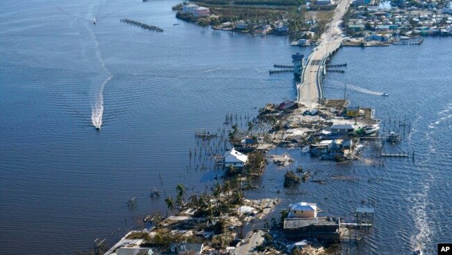 The bridge leading from Fort Myers to Pine Island, Fla., is heavily damaged in the aftermath of Hurricane Ian, Oct. 1, 2022.