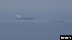 Grain ships carrying Ukrainian grain are seen in the Black Sea, amid Russia's attack on Ukraine, near Ukrainian port of Odesa, Ukraine, Oct. 30, 2022. 