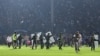 Anggota TNI mengamankan lapangan setelah pertandingan sepak bola antara Arema FC dan Persebaya Surabaya di Stadion Kanjuruhan di Malang, Jawa Timur. (Foto: AFP)