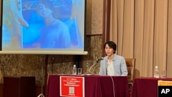 FILE - Images of Toru Kubota, a Japanese journalist detained in Myanmar while covering a protest, are displayed at the Japan Press Club in Tokyo on Aug. 3, 2022 as his friends gathered at the club calling for his immediate release.