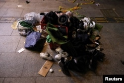 Belongings of victims are seen at the scene where many people died and were injured in a stampede during a Halloween festival in Seoul, South Korea, Oct. 30, 2022.