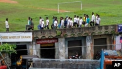 FILE - Members of the Muslim organization Popular Front of India (PFI) undergo parade training at a football ground in Kottayam, southern Kerala state, India, June 27, 2010.