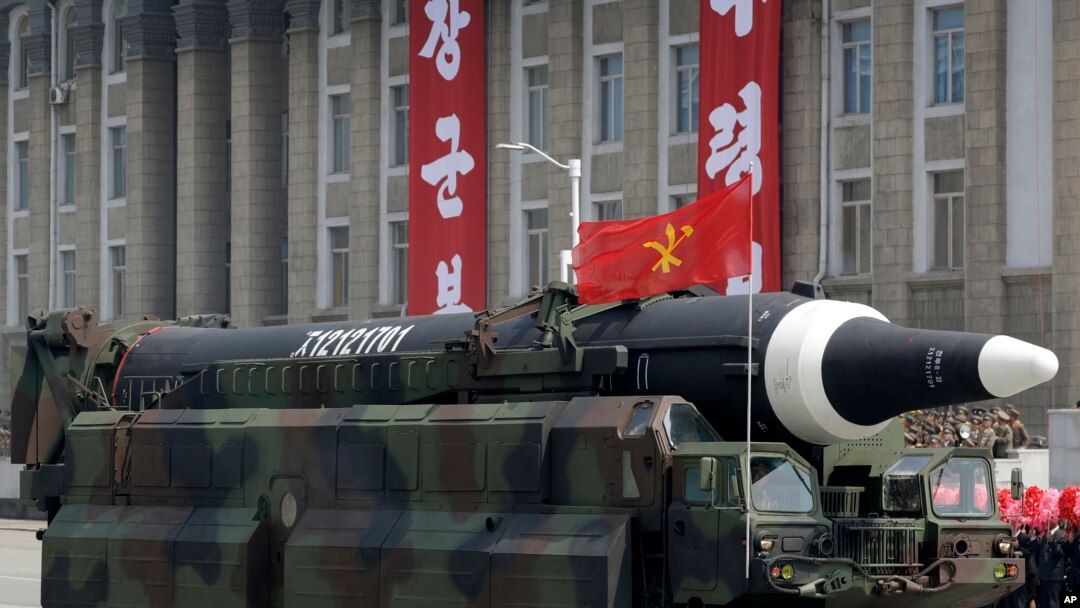FILE - A missile that analysts believe could be the North Korean Hwasong-12 is paraded in North Korea on April 15, 2017. Japanese Defense Minister Yasukazu Hamada said a missile North Korea fired over Japan on Tuesday could have been a Hwasong-12.