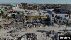 FILE - Remains of destroyed restaurants, shops and other businesses are seen almost one month after Hurricane Ian landfall in Fort Myers Beach, Florida, Oct. 26, 2022.