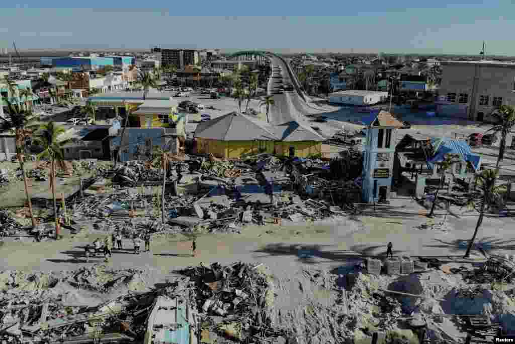 Remains of destroyed restaurants, shops and other businesses are seen almost one month after Hurricane Ian landfall in Fort Myers Beach, Florida.