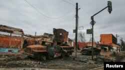 FILE - Destroyed Russian military vehicles are seen as Russia’s attack on Ukraine continues, in the town of Trostianets, in Sumy region, Ukraine, March 28, 2022.