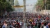 People march during a protest against the government and rising fuel prices, in Port-au-Prince, Haiti, Oct. 3, 2022.