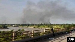 FILE: Smoke billows in al-Roseires in Sudan's southern Blue Nile state on September 2, 2022 amid renewed ethnic clashes despite a ceasefire agreement between rival groups following deadly violence weeks ago. 