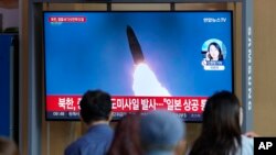 A TV screen showing a news program reporting about North Korea's missile launch with file footage, is seen at the Seoul Railway Station in Seoul, South Korea, Oct. 4, 2022.