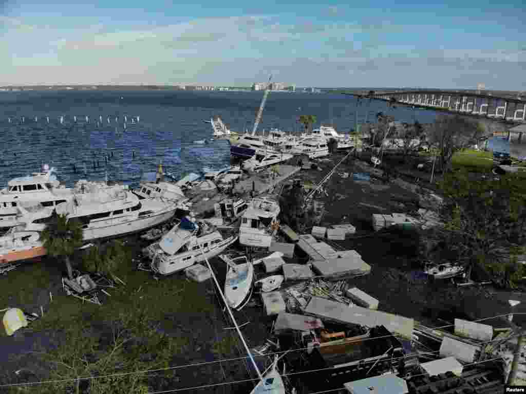 Damaged boats are seen downtown Fort Myers, Florida, after Hurricane Ian caused widespread destruction.