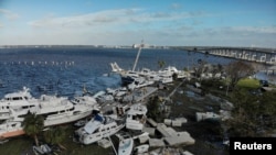 Damaged boats are seen downtown Fort Myers, Florida, after Hurricane Ian caused widespread destruction.