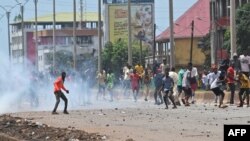 FILE: Protestors throw rocks and block roads after the outlawed opposition group, The National Front for the Defence of the Constitution (FNDC), called for protests against the ruling Junta in Conakry on October 20,2022