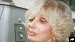 FILE - American mezzo-soprano Joanna Simon leaves St. Bartholomew's Church in New York, July 23, 2009 after the funeral for Walter Cronkite. 