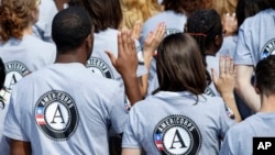 In this Sept. 12, 2014 file photo, as President Barack Obama and former President Bill Clinton mark the 20th anniversary of the AmeriCorps national service program.