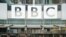 FILE - BBC signage is seen outside the headquarters of the organization, in London, July 19, 2017. 