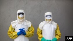 FILE - Staff from South Sudan's Health Ministry pose with protective suits during a drill for Ebola preparedness conducted by the World Health Organization (WHO) with ALIMA (The Alliance for International Medical Action) and International Medical Corps in Juba, August 14, 2019.
