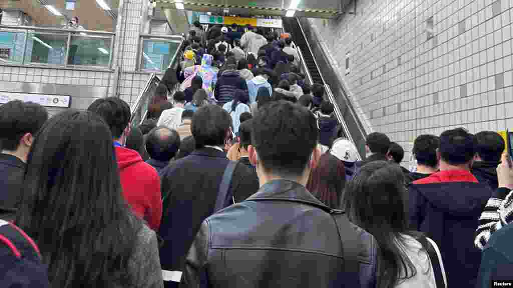 A crowded escalator during a Halloween festival in Seoul, South Korea, Oct. 29, 2022, is seen in this picture obtained from social media. 