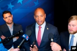 FILE - Gubernatorial candidate Democrat Wes Moore talks to reporters after a debate with his opponent Republican Dan Cox, Wednesday, Oct. 12, 2022 in Owings Mills, Md. (AP Photo/Brian Witte)