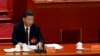 中共领导人习近平和前中共领导人胡锦涛曾经坐过的空椅子。（2022年10月22日）