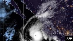 This handout satellite provided by the National Oceanic and Atmospheric Administration (NOAA), Oct. 2, 2022 shows Hurricane Orlene hurtling towards Mexico. (Photo by handout / NOAA / AFP) 