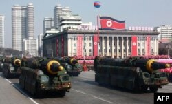 This photo taken on February 8, 2018 and released on February 9, 2018 by North Korea's official Korean Central News Agency (KCNA) shows Hwasong-12 ballistic missiles during the military parade to mark the 70th anniversary of the Korean People's Army at Kim Il Sung Square in Pyongyang.