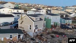 This handout image provided by Amy Ingram on Sept. 25, 2022, shows damage caused by Hurricane Fiona in Channel-Port aux Basques, Newfoundland and Labrador, Canada.