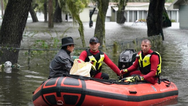 Residents in an Orlando, Fla., neighborhood are rescued due to floodwaters from Hurricane Ian, Sept. 29, 2022.