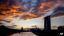 Clouds drift over the European Central Bank in Frankfurt, Germany, Sept. 19, 2022.