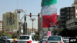A partial view shows traffic in Iran's capital Tehran, Sept. 28, 2022. Iran's police warned they will confront "with all their might" women-led protests that erupted nearly two weeks ago over the death of Mahsa Amini while in custody.