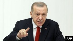 FILE - Turkish President Recep Tayyip Erdogan addresses parliament at the Grand National Assembly of Turkey, in Ankara, Oct. 1, 2022. The U.S. is trying talk Erdogan out of launching an offensive against American-allied Kurdish forces in neighboring Syria.
