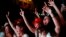 Supporters of Brazil's former President Luiz Inacio Lula da Silva celebrate partial results after polls closed in the country's presidential runoff election, in Rio de Janeiro, Oct. 30, 2022.