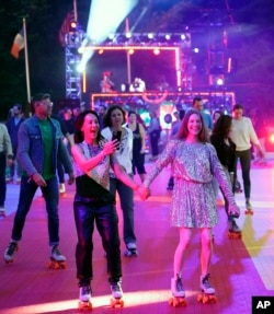 Roller skaters attend the DiscOasis opening night party at Wollman Rink in Central Park on June 18, 2022, in New York. (Photo by Charles Sykes/Invision/AP)