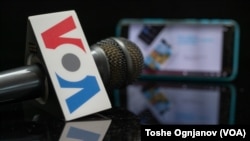VOA logo with mobile app and microphone
