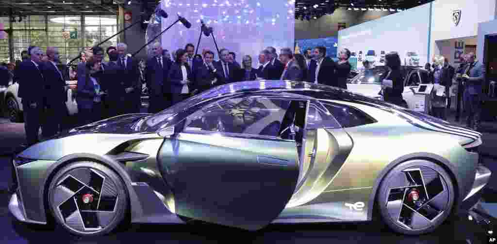 French President Emmanuel Macron views the Peugeot DS E-Tense Performance at the Paris Car Show.