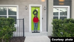 Florida homeowner Shaniqua "Shan" Rose in front of the main entrance of her home in Orlando's Parramore neighborhood. (Photo courtesy Shaniqua Rose) 