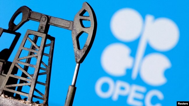 FILE PHOTO: A 3D printed oil pump jack is seen in front of displayed OPEC logo in this illustration picture, Apr. 14, 2020.
