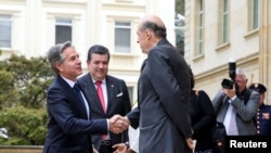 U.S. Secretary of State Antony Blinken greets Alvaro Leiva Colombian Foreign Minister at the Presidential palace, in Bogota, Colombia, Oct. 3, 2022.