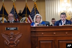 Vice chair Rep. Liz Cheney offers a motion to subpoena former President Donald Trump as Chairman Rep. Bennie Thompson, left, and Rep. Adam Kinzinger listen during the House select committee investigating the Jan. 6 attack on the U.S. Capitol, Oct. 13, 202