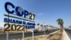 View of a COP27 sign on the road leading to the conference area in Egypt's Red Sea resort of Sharm el-Sheikh, Oct. 20, 2022.