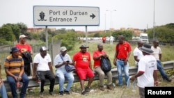 FILE - Transnet workers protest as a labour strike continues at an entrance to the harbour in Durban, South Africa. Taken Oct. 17, 2022