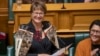 Anggota parlemen baru Partai Buruh Soraya Peke-Mason tersenyum saat menyampaikan pidato pertamanya di Parlemen, di Wellington, Selandia Baru, Selasa, 25 Oktober 2022. (Mark Mitchell/New Zealand Herald via AP)