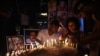FILE - People hold a candlelight vigil for the victims and injured demonstrators during anti-government protests, in Colombo, July 16, 2022.